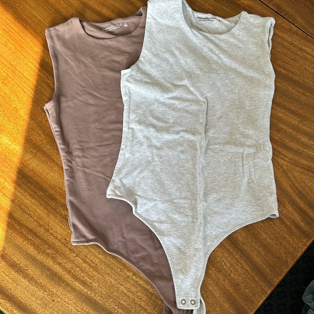 Two Abercrombie & Fitch soft af bodysuits